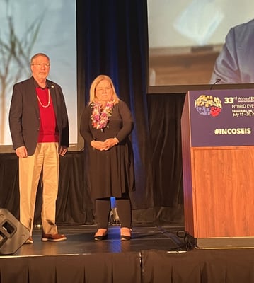 INCOSE award recognition of Steven Dam for the Founder's Award, with INCOSE President, Marilee Wheaton